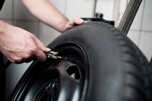 person repairing a tire