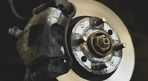 Close-up of a vehicle’s brake assembly showing the brake caliper