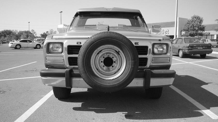 Black and white photo of a truck parked Black and white photo of a truck parked
