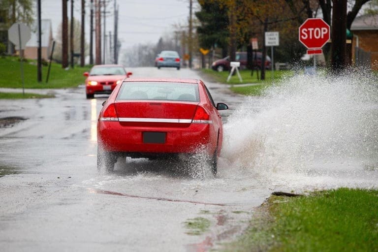 Vehicle Driving Through Standing Water