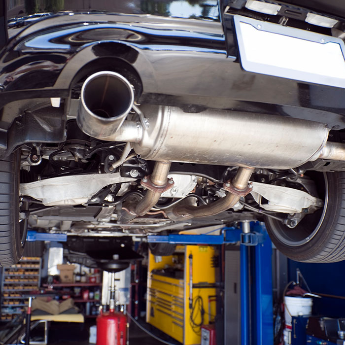 Cars up on lifts in an auto repair shop