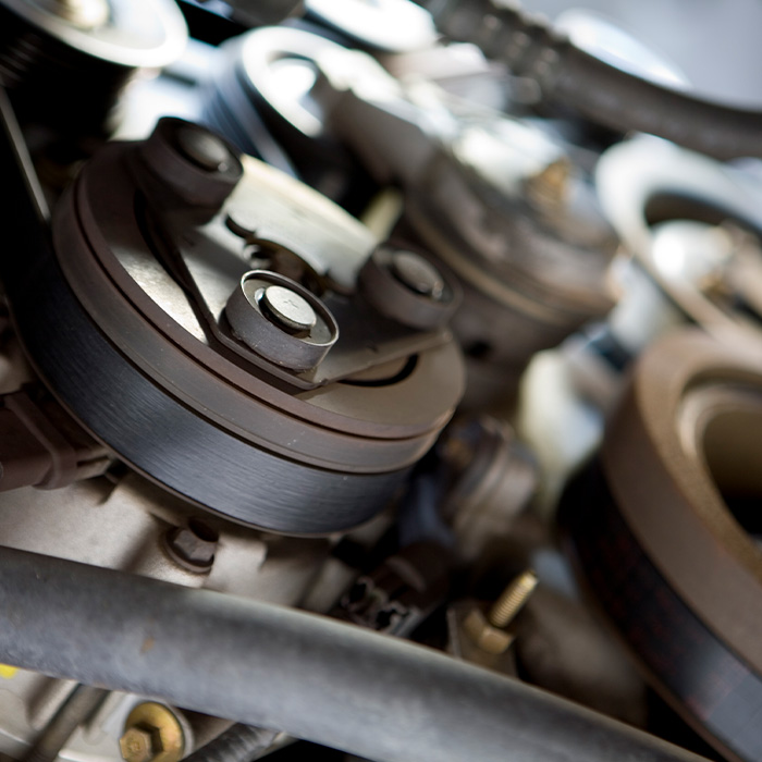 Interesting angle of a car engine in a repair facility