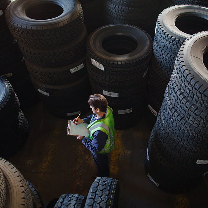 Tire repair repairman specialist small business owner in an auto garage