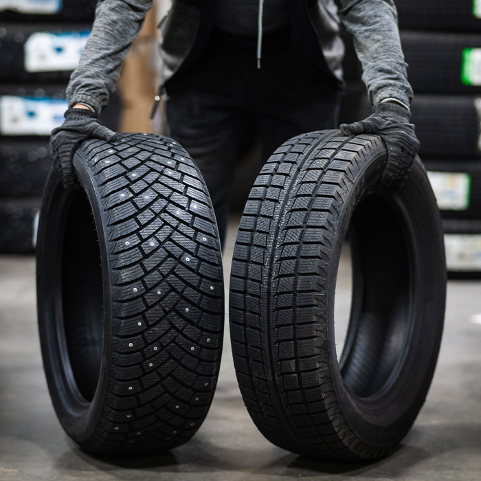 Mechanic keeps new summer and winter car tires in the garage