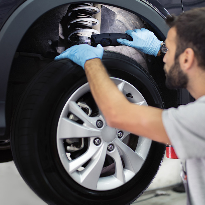 Auto mechanic working in garage