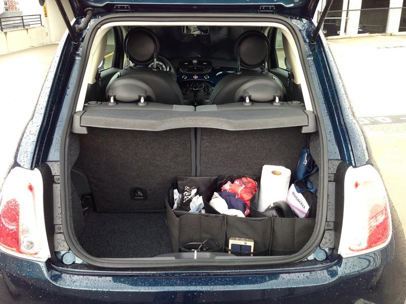 A small car's rear with the trunk open A small car's rear with the trunk open